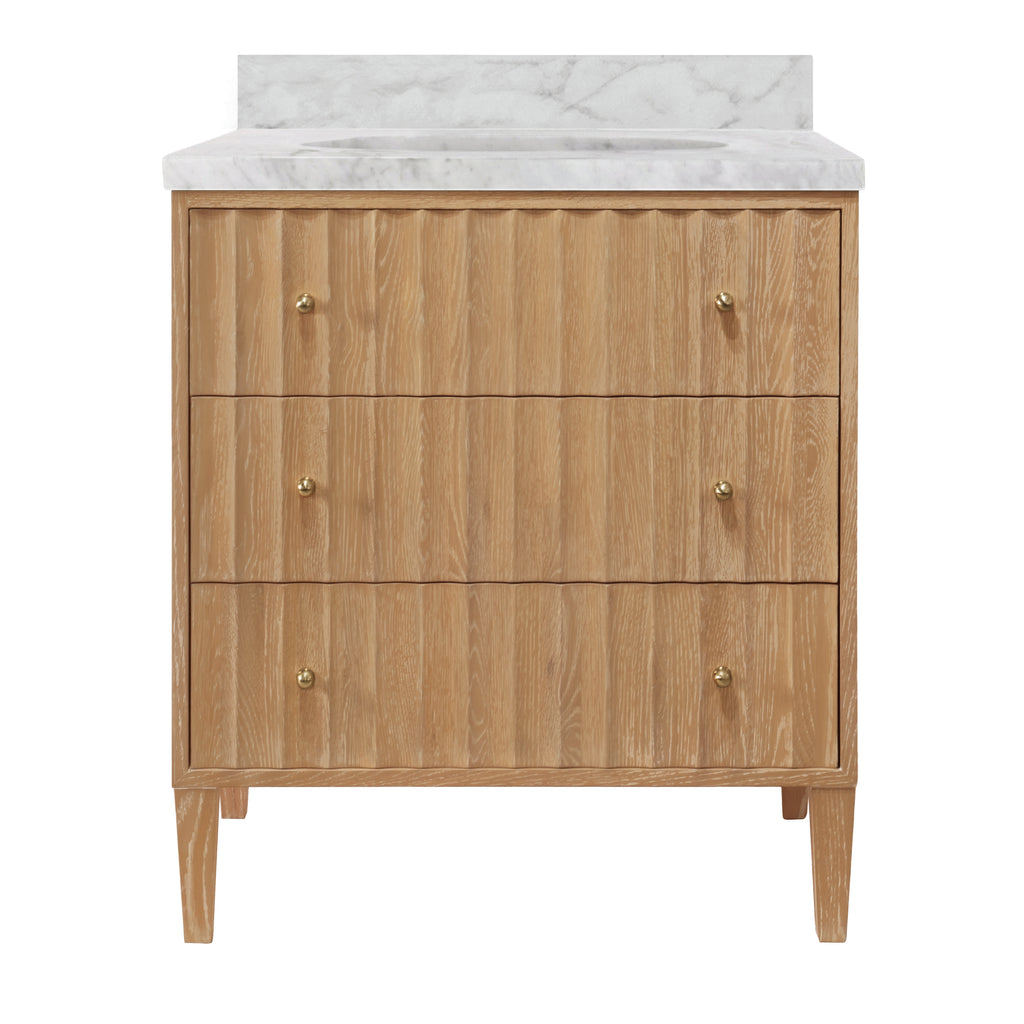 Bath Vanity with Vertical Fluted Detail on Drawers in Cerused Oak with White Marble Top, Porcelain Sink, and Polished Brass Knobs