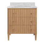 Bath Vanity with Vertical Fluted Detail on Drawers in Cerused Oak with White Marble Top, Porcelain Sink, and Polished Brass Knobs