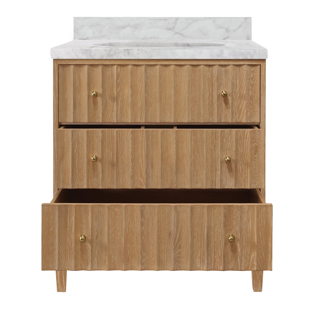 Bath Vanity with Vertical Fluted Detail on Drawers in Cerused Oak with White Marble Top, Porcelain Sink, and Polished Brass Knobs
